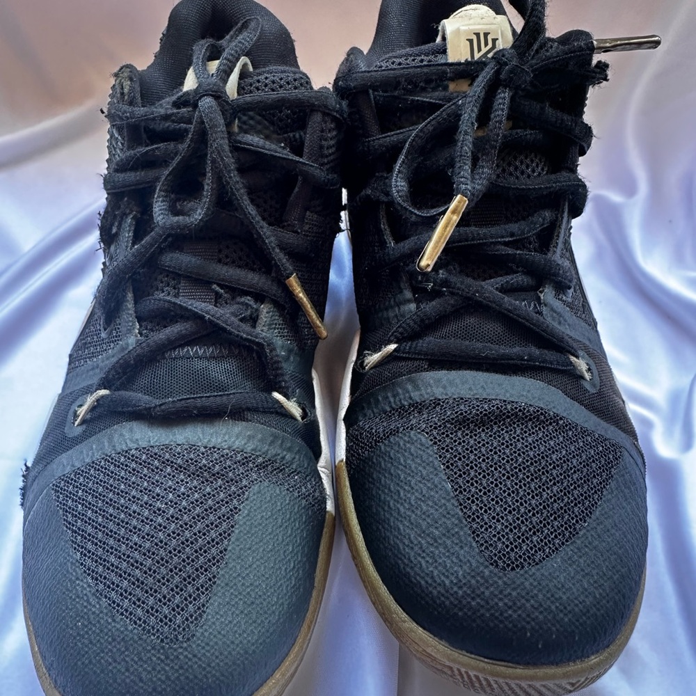 Nike Black Athletic Shoes with Gold Accents
